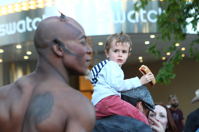 Three-year-old Charlie Thibeault reacts to a Cirque du Soleil Zumanity cast member before a portion of the show is performed outside of the New York-New York hotel-casino in Las Vegas on Thursday, ...