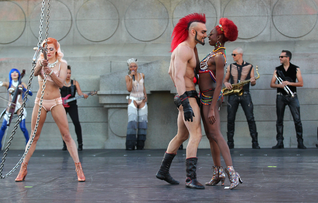 Aerialist Brandon Pereyda, second from left, of Cirque du Soleil's Zumanity performs a portion of the show outside of the New York-New York hotel-casino in Las Vegas on Thursday, Feb. 26, 2015. Th ...