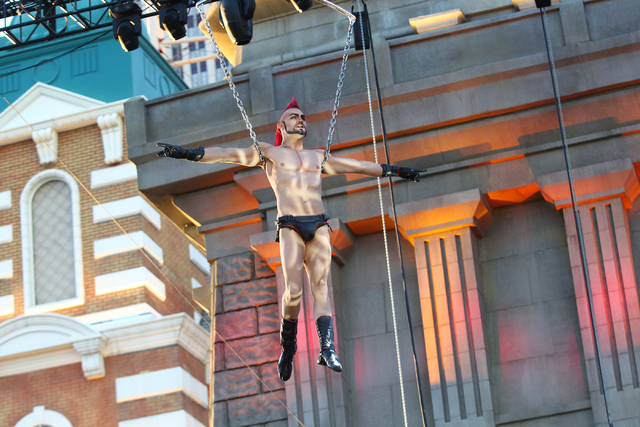 Aerialist Brandon Pereyda of Cirque du Soleil's Zumanity performs a portion of the show outside of the New York-New York hotel-casino in Las Vegas on Thursday, Feb. 26, 2015. The show includes new ...