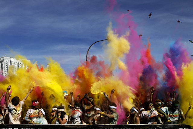 Participants in the Color Run Las Vegas throw up colored powder into the air after participating in the run and walk in downtown Las Vegas Saturday, Feb. 16, 2013. (John Locher/Las Vegas Review-Jo ...