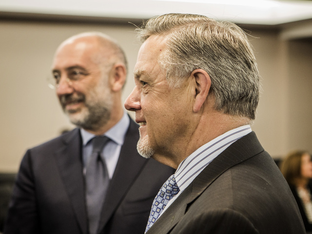 Marco Sala, left, CEO of GTECH Holdings, and Phil Satre, left, International Game Technology chairman, during a special Gaming Control Board Hearing on the licensing of the GTech-IGT merger/buyout ...