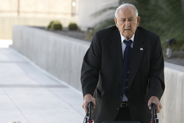 Salvatore Ruvolo, co-defendant in a federal case involving fraud and corruption at Las Vegas homeowners associations, walks to Lloyd George Federal Courthouse in Las Vegas Wednesday, Feb. 25, 2015 ...