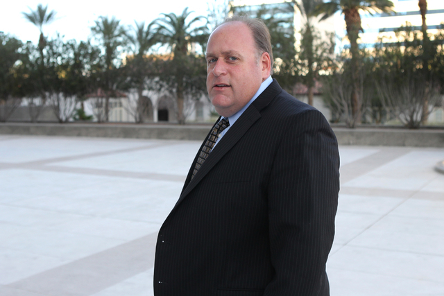 Chris Rasmussen, attorney for co-defendant Edith Gillespie in a federal case involving fraud and corruption at Las Vegas homeowners associations, walks to Lloyd George Federal Courthouse in Las Ve ...