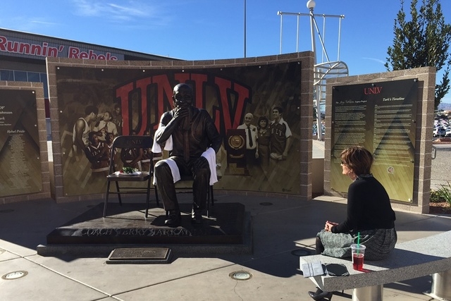 UNLV Athletic Director Tina Kunzer-Murphy spends a moment with the Jerry Tarkanian statue. (Chase Stevens/Las Vegas Review-Journal)