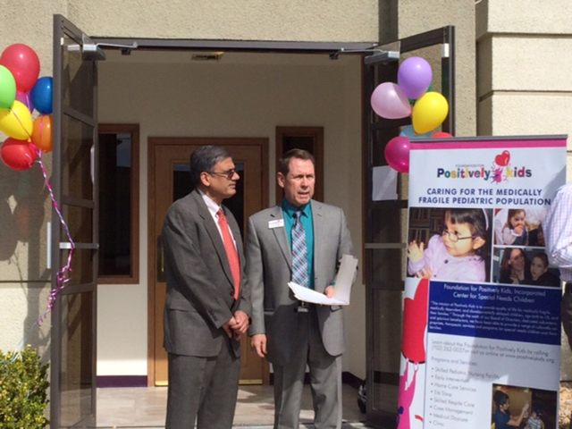 From left, Dr. Abdulla and Positively Kids founder Fred Schultz stand together at the grand opening ceremony of the clinic at 2480 E. Tompkins, Feb. 19, 2015.