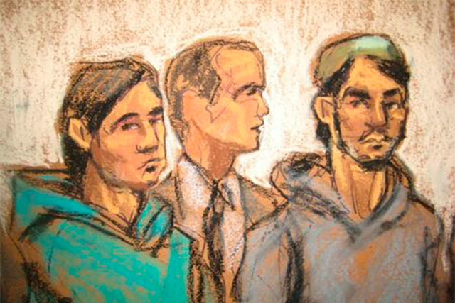 Akhror Saidakhmetov, left, and Abdurasul Hasanovich Juraboev, right, appear with court interpreter Akhror Saidakmetov in Brooklyn federal court in New York, Wednesday, Feb. 25, 2015. (Reuters/Jane ...