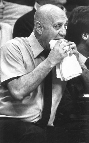 UNLV Rebels basketball coach Jerry Tarkanian bites a towel during a game at the Thomas & Mack Center in Las Vegas, Feb. 16, 1987. (Scott Henry/Las Vegas Review-Journal)
