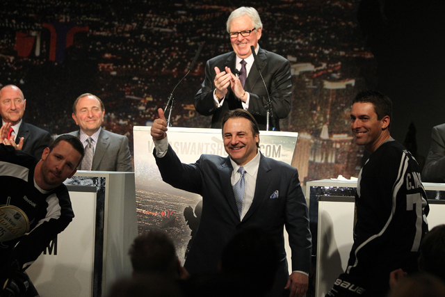 Gavin Patrick Maloof, vice chairman of Maloof Companies, center, gives a thumbs up as Bill Foley, center rear, announces the launch of the NHL team ticket deposit drive for a Las Vegas team, with  ...