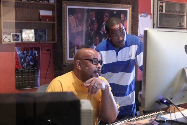 Kenneth Borner, right, also known as Wordz, works with his music producer Silas Washington at his studio in Las Vegas Thursday, Feb. 12, 2015. Borner, 27, a Christian rapper, was born with sickle  ...