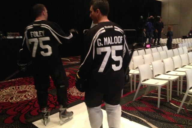 Two men dressed as NHL hockey players with Bill Foley and Gavin Maloof jersey's play a part in the NHL Las Vegas ticket drive press conference on Tuesday, Feb. 10,2015. With NHL Commissioner Gary ...