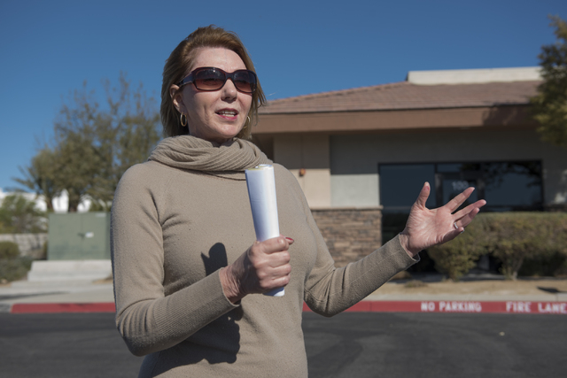 Sun City Anthem resident and shopping center tenant Diana Redman talks about her concerns regarding a proposed medical marijuana near her business from the Anthem Hills Professional Plaza in Hende ...