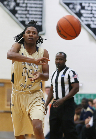 Shadow Ridge's Ray Perkins passes the ball during a basketball game against Palo Verde at Palo Verde High School Tuesday, Feb. 10, 2015, in Las Vegas. Palo Verde won 77-71. (Ronda Churchill/Las Ve ...