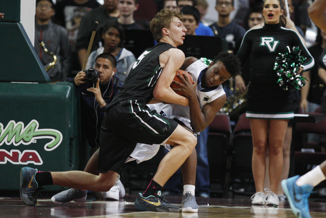 Canyon Springs guard Antonio Longmyers and Palo Verde forward Grant Dressler fight for a rebound during their Division I state semifinal game Thursday, Feb. 26, 2015, at the Orleans Arena. (Sam Mo ...