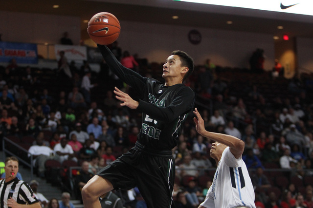 Palo Verde guard Taylor Miller drives to the basket past Canyon Springs guard Jordan Davis during their Division I state semifinal game Thursday, Feb. 26, 2015, at the Orleans Arena. (Sam Morris/L ...