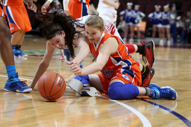 Liberty guard Kealy Brown and Bishop Gorman guard Skylar Jackson scramble for a loose ball during their Division I state semifinal game Thursday, Feb. 26, 2015, at the Orleans Arena. Bishop Gorman ...