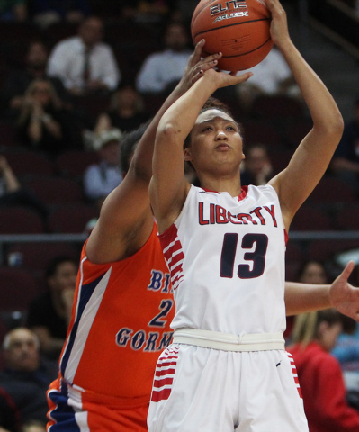 Bishop Gorman guard Lauren Solomon disrupts a shot by Liberty guard Aubre Fortner during their Division I state semifinal game Thursday, Feb. 26, 2015, at the Orleans Arena. Bishop Gorman won 39-3 ...