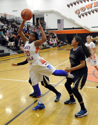 Bishop Gorman guard Skylar Jackson (20) tries to haul in a rebound against Foothill in the third quarter of the Division I state play-in game game at Chaparral on Monday. Jackson had 13 points and ...