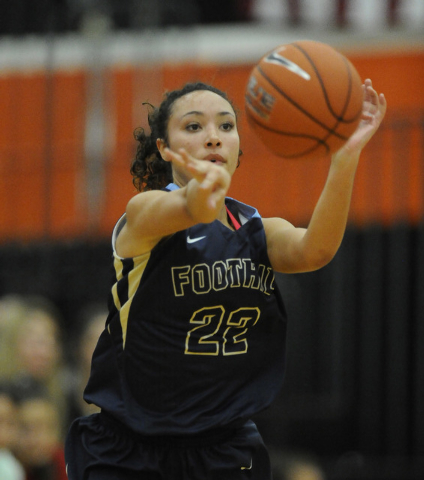 Foothill guard Katey Roquemore passes against Bishop Gorman in the third quarter of the Division I state play-in game at Chaparral on Monday. Roquemore led the Falcons with 17 points. (Josh Holmbe ...
