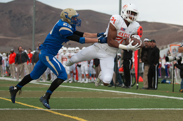 Bishop Gorman’s Cordell Broadus (21) catches a touchdown pass against Reed’s Por ...