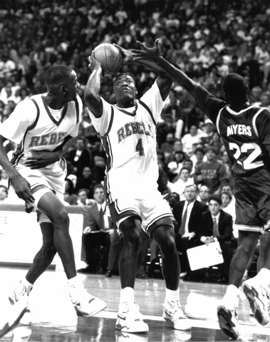 courtesy
UNLV forward Larry Johnson looks to get off a shot past an unnamed opponent, as Rebels forward Stacey Augmon trails the play, during a game in the program’s 1989-90 national championshi ...