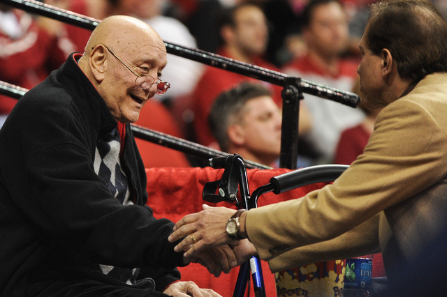 Former UNLV coach Jerry Tarkanian shakes hands with a fan on during a basketball game between the Rebels and Northern Arizona at Thomas & Mack Center Nov. 12, 2012. (David Cleveland/Las Vegas Revi ...