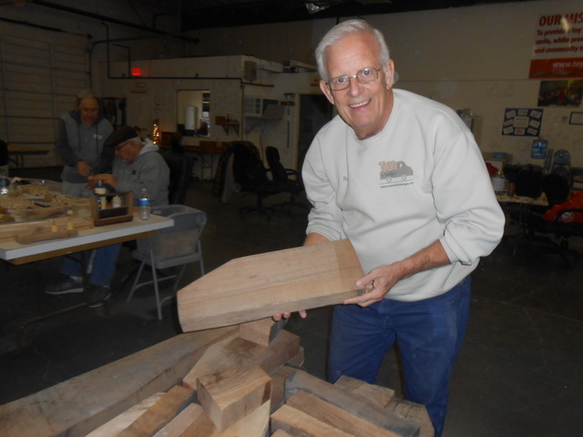 Toys 4 Smiles founder Rex Doty holds wood scraps that will be made into simple wooden toy cars for children in need. The group completed its 200,000th toy car in December. (Jan Hogan/View)