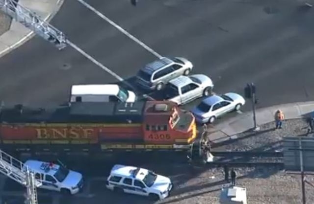 A woman was hospitalized in serious condition but expected to survive after she was run over by a pair of locomotives in Phoenix on Thursday morning. (Screengrab, azcentral.com)