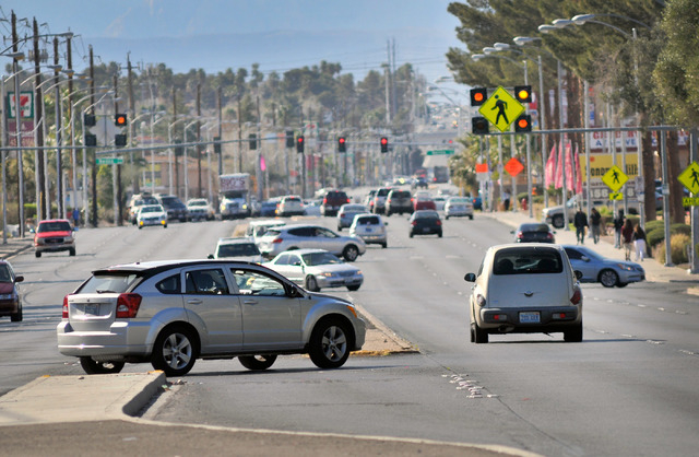 Vehicle traffic moves along East Tropicana Avenue near Denning Street in Las Vegas on Thursday, Feb. 26, 2015. Median barriers are scheduled to be built over the next four years to prevent people  ...