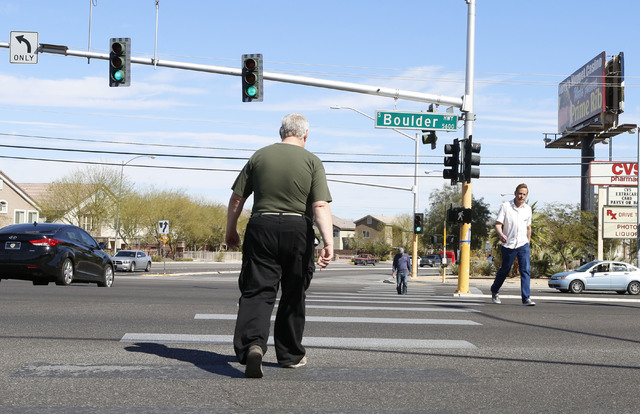 Pedestrians cross the 5600 block of Boulder Hwy and Tropicana Ave., Thursday, Feb. 26, 2015.  Improvements to Tropicana Avenue between Eastern Avenue and Boulder Highway will include the widening  ...