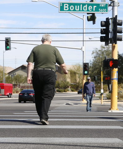 Pedestrians cross the 5600 block of Boulder Hwy and Tropicana Ave., Thursday, Feb. 26, 2015. Improvements to Tropicana Avenue between Eastern Avenue and Boulder Highway will include the widening o ...