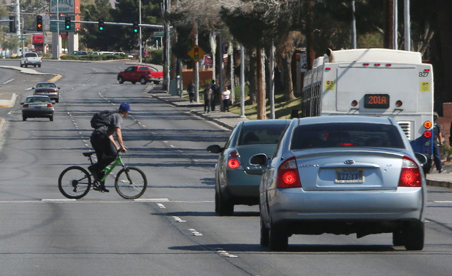 A cyclist crosses Tropicana Ave., near Morris St., Thursday, Feb. 26, 2015.  Improvements to Tropicana Avenue between Eastern Avenue and Boulder Highway will include the widening of some sidewalks ...