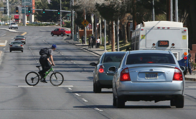 A cyclist crosses Tropicana Ave., near Morris St., Thursday, Feb. 26, 2015. Improvements to Tropicana Avenue between Eastern Avenue and Boulder Highway will include the widening of some sidewalks ...