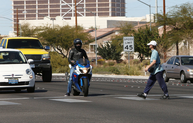 A pedestrian crosses Boulder Hwy., at the 5600 block of Boulder and Tropicana Ave., Thursday, Feb. 26, 2015. Improvements to Tropicana Avenue between Eastern Avenue and Boulder Highway will includ ...