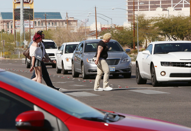 Pedestrians cross Boulder Hwy., at the 5600 block of Boulder and Tropicana Ave., Thursday, Feb. 26, 2015.  Improvements to Tropicana Avenue between Eastern Avenue and Boulder Highway will include  ...