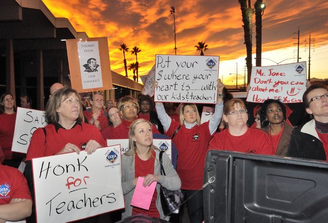 Clark County Education Association supporters listen to CCEA union president Ruben Murillo during a rally outside the Edward Greer Education Center at 2832 E. Flamingo Road on Thursday, Jan. 26, 2 ...