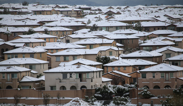 An overnight snowfall dusts rooftops in Summerlin on Monday, Feb. 23, 2015. (Mark Antonuccio/Las Vegas Review-Journal)