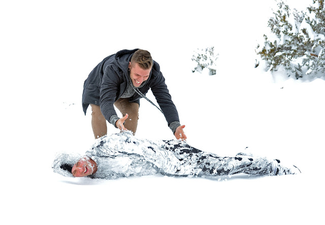 Chris West rolls Andrew Hansen across a snow bank while the two took advantage of the fresh fallen snow at Cold Creek on Monday, Feb. 23, 2015.  About one-foot of snow fell overnight on the mounta ...