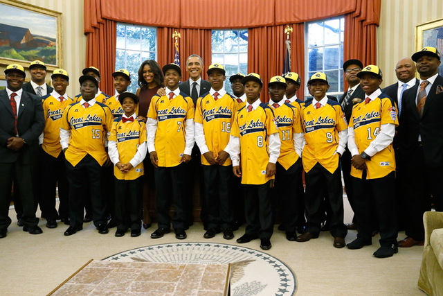 U.S. President Barack Obama  and first lady Michelle Obama welcome members of the Jackie Robinson West All Stars Little League baseball team from Chicago in the Oval Office at the White House in W ...