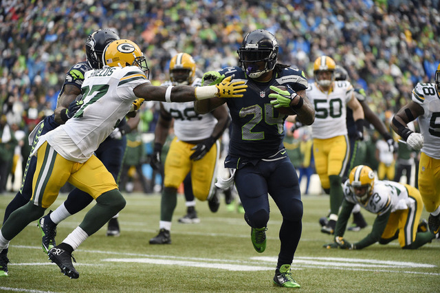 Seattle Seahawks running back Marshawn Lynch (24) runs the ball against Green Bay Packers cornerback Sam Shields (37) during the second half in the NFC Championship game at CenturyLink Field, Jan. ...