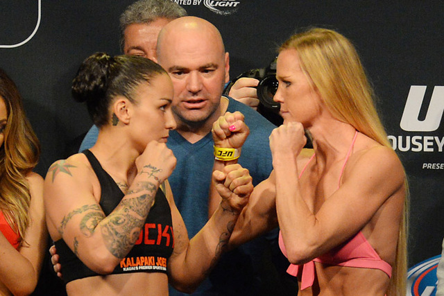 Feb 27, 2015; Los Angeles, CA, USA;  Raquel Pennington and Holly Holm face off at the weigh-in for their fight at UFC 184 at Staples Center. Mandatory Credit: Jayne Kamin-Oncea-USA TODAY Sports