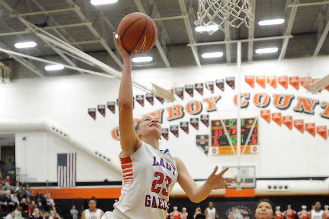 Bishop Gorman forward Megan Jacobs (23) scores on a layup against Foothill in the second quarter of the Division I state play-in game at Chaparral on Monday. Jacobs had 12 points and nine rebounds ...
