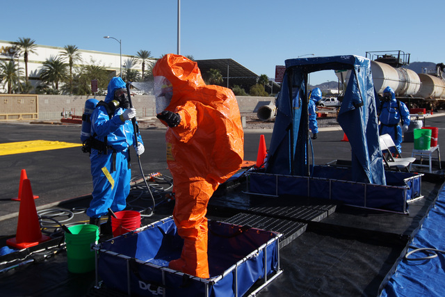 Members of the Nevada National Guard's 92nd Civil Support Team are "decontaminated" during an emergency preparedness drill Wednesday, Feb. 25, 2015. (Sam Morris/Las Vegas Review-Journal)