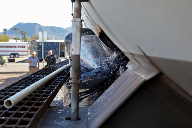 Members of the Nevada National Guard's 92nd Civil Support Team work to plug a train tanker and its simulated bleach leak during an emergency preparedness drill Wednesday, Feb. 25, 2015. (Sam Morri ...