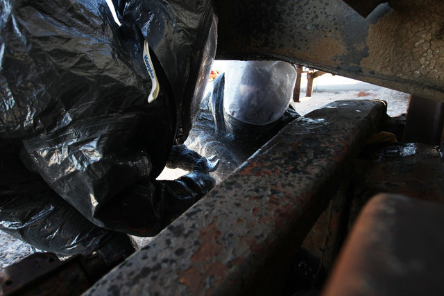 Members of the Nevada National Guard's 92nd Civil Support Team work to plug a train tanker and its simulated bleach leak during an emergency preparedness drill Wednesday, Feb. 25, 2015. (Sam Morri ...