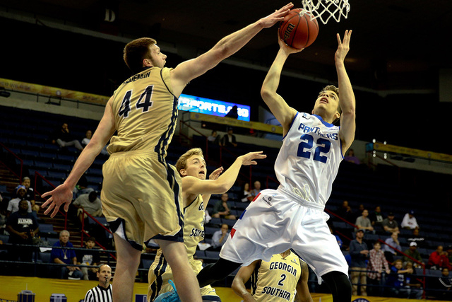 Mar 15, 2015; New Orleans, LA, USA; Georgia State Panthers guard R.J. Hunter (22) shoots as Georgia Southern Eagles forward Trent Wiedeman (44) defends during the first half of the Sun Belt Confer ...