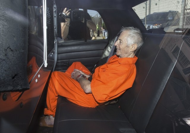 Robert Durst sits in a police vehicle as he leaves a courthouse in New Orleans, March 17, 2015. (REUTERS/Lee Celano)