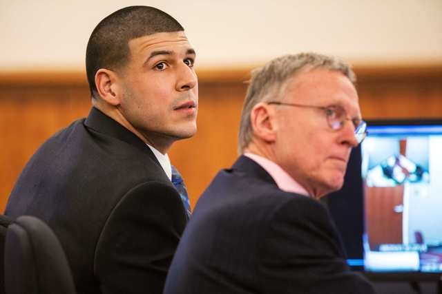 Aaron Hernandez sits with his attorney Charles Rankin during his murder trial at the Bristol County Superior Court in Fall River, Massachusetts, March 17, 2015. (REUTERS/Aram Boghosian/Pool)