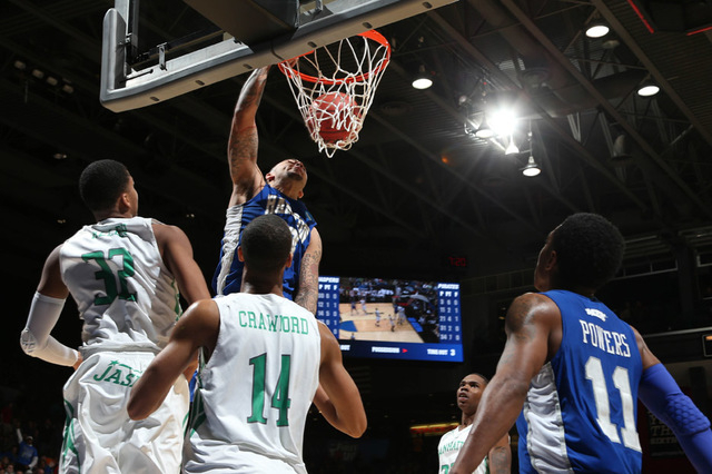 Mar 17, 2015; Dayton, OH, USA; Hampton Pirates guard Quinton Chievous (3) dunks the ball during the first half against the Manhattan Jaspers in the first round of the 2015 NCAA Tournament at UD Ar ...