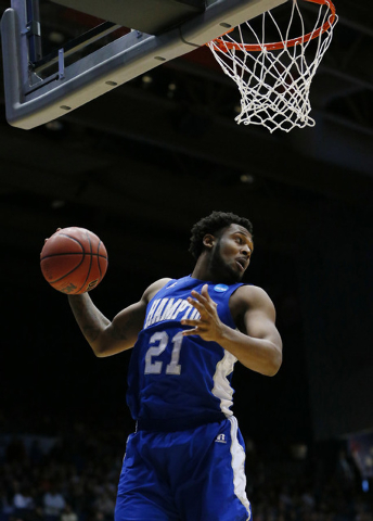 Mar 17, 2015; Dayton, OH, USA; Hampton Pirates guard Ke'Ron Brown (21) grabs a rebound during the first half against the Manhattan Jaspers in the first round of the 2015 NCAA Tournament at UD Aren ...