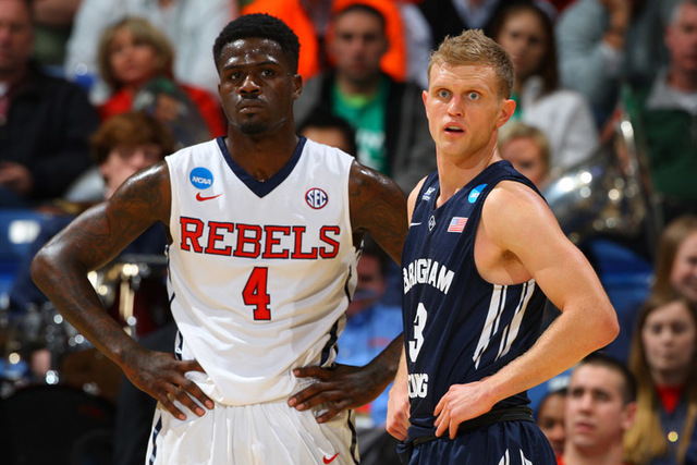 Mar 17, 2015; Dayton, OH, USA; Mississippi Rebels forward M.J. Rhett (4) and Brigham Young Cougars guard Tyler Haws (3) stand on the court during the first half in the first round of the 2015 NCAA ...